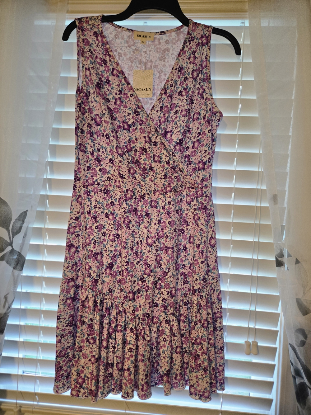 Vacasun Sleeveless Floral Mini Dress showcasing a purple-toned flower pattern.